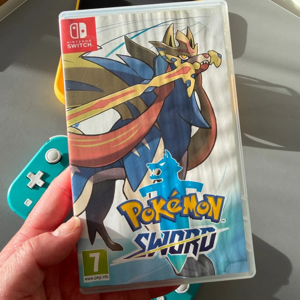 Teal Nintendo Switch Lite with Pokémon Sword